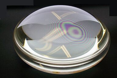 Newton's Rings: concentric circles of colour between two glass lenses