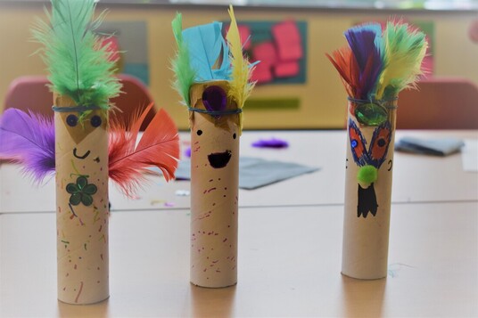 Three home made Kazoos made from decorated carboard tubes.