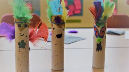 Photograph of three kazoos made from decorated cardboard tubes